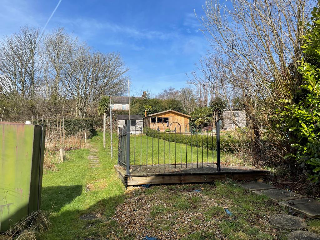 Lot: 111 - WELL PRESENTED MID-TERRACE HOUSE - Garden with grass and wooden shed